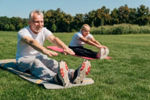 older couple stretching outside