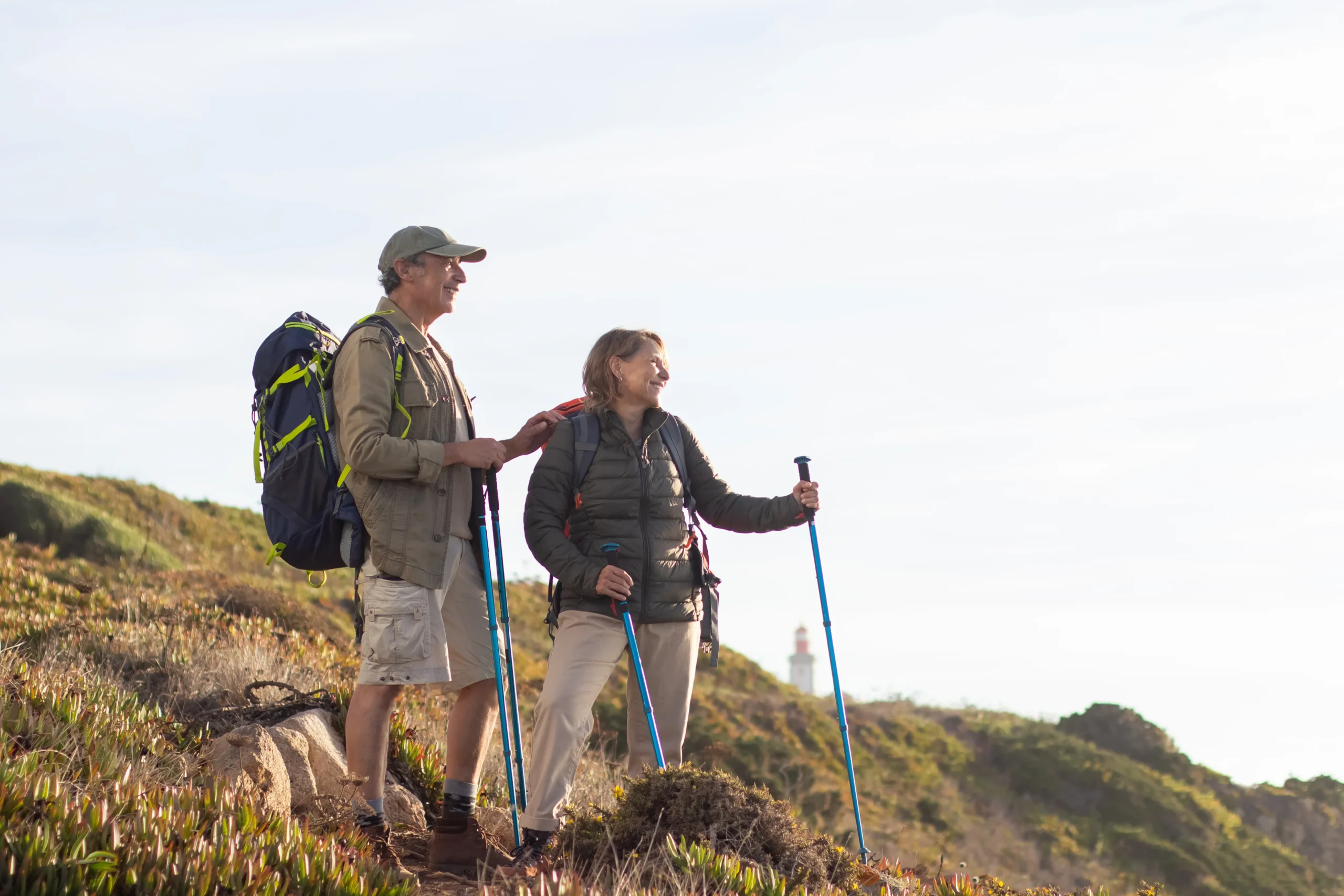 older couple hiking on a moutain